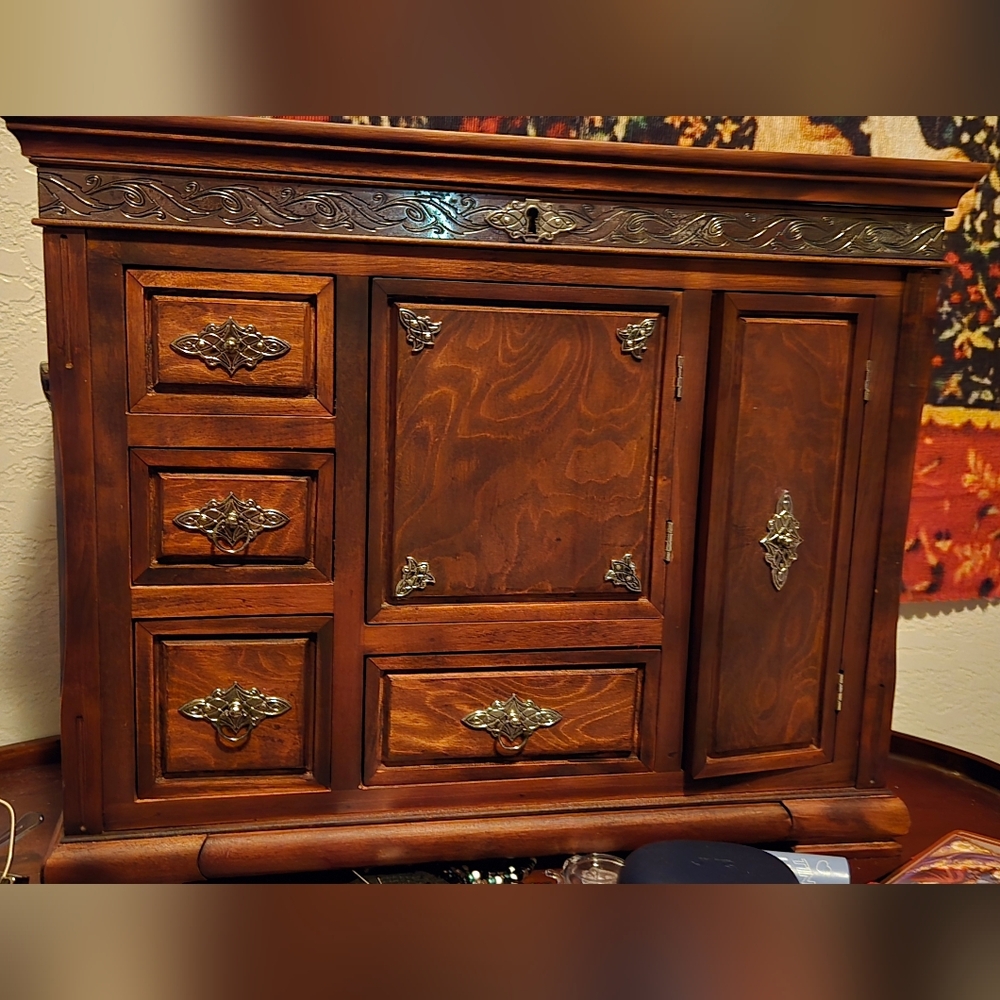 Elegant Wooden Cabinet with Silver Accents